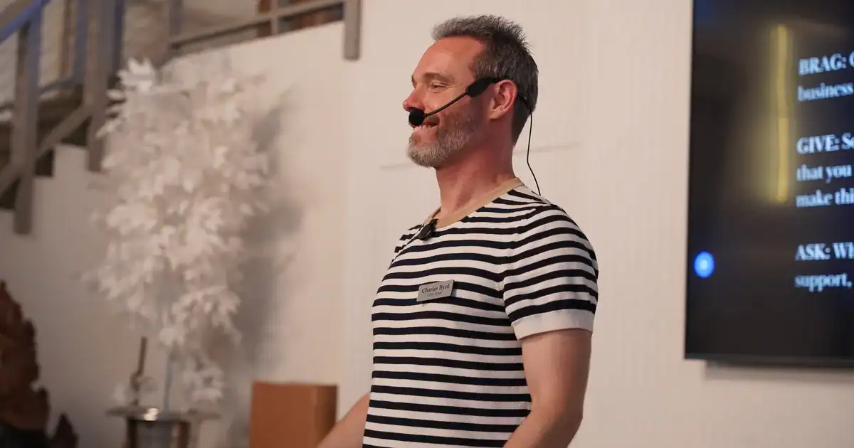 Charles Byrd speaking to entrepreneurs with a headset microphone