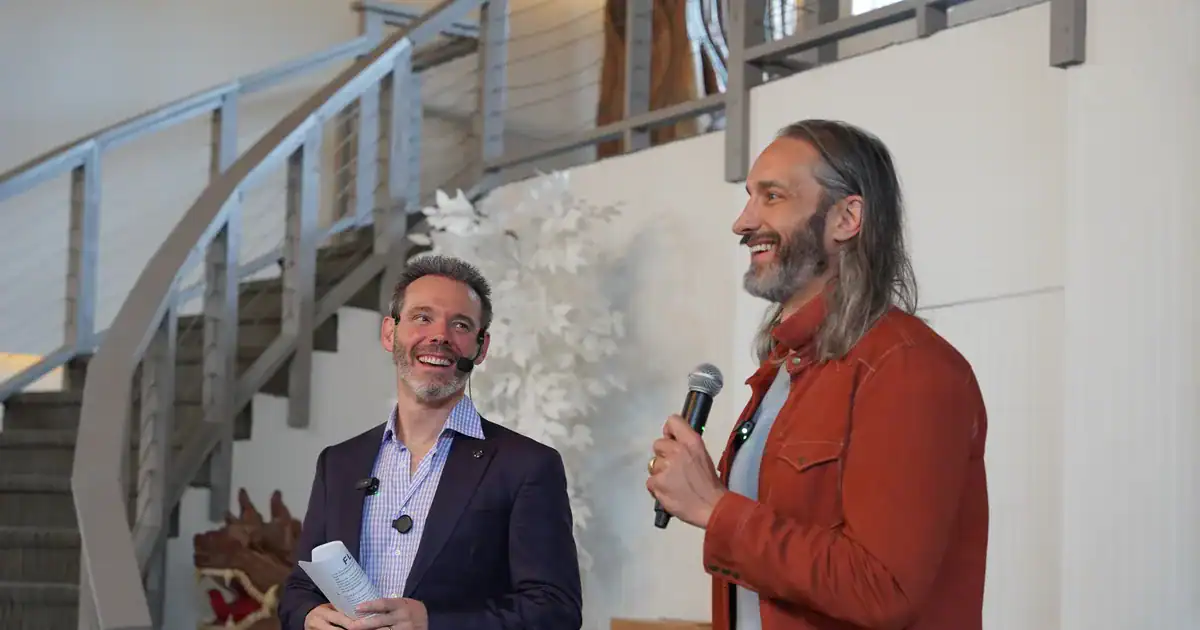 Charles Byrd sharing the stage with a fellow entrepreneur at a Flow Mastermind session