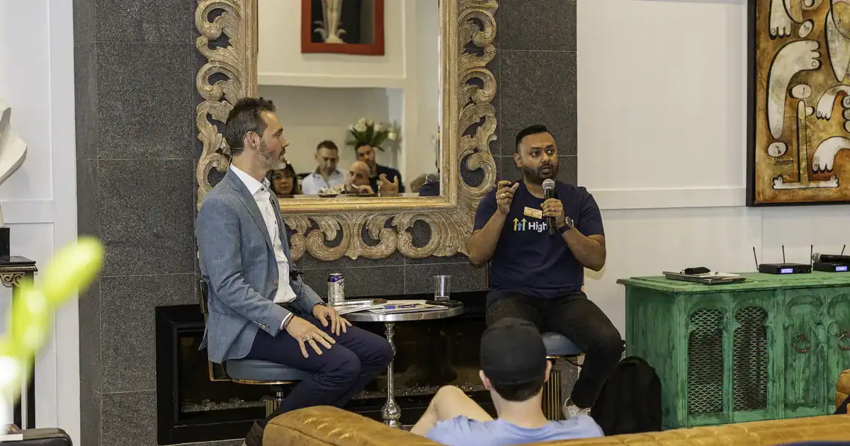 Charles Byrd interviewing an entrepreneur in front of a live audience